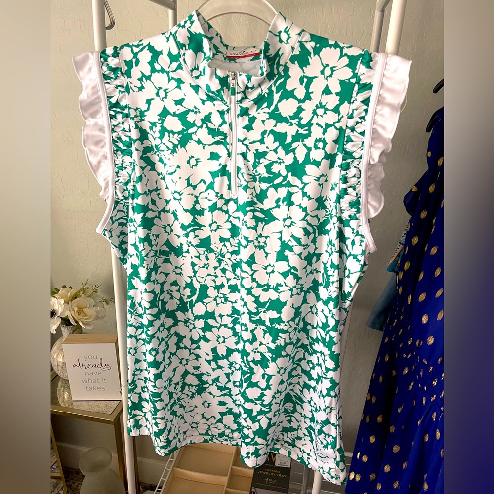 NWOT Cute ruffle sleeveless ladies golf pull over. Half zip. Never worn.